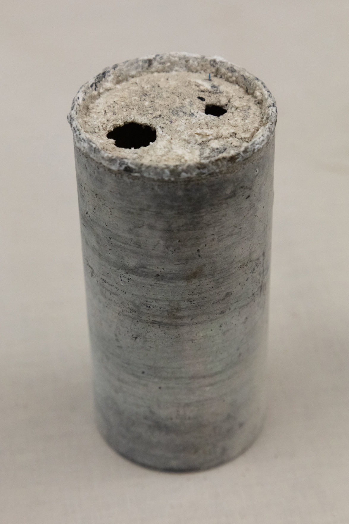 Can with mineral deposit buildup